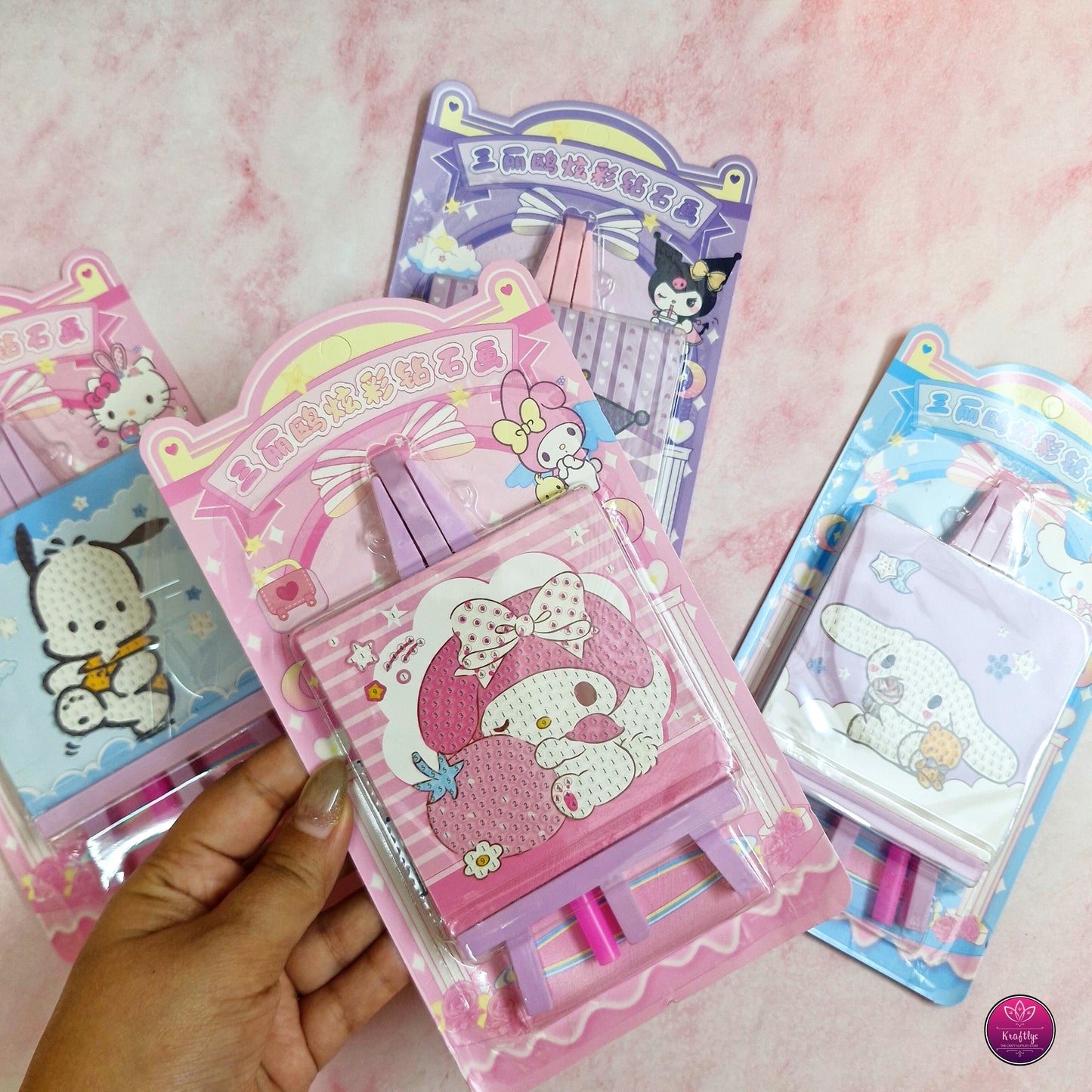 Sanrio-themed diamond art kits featuring My Melody, Kuromi, Cinnamoroll, and Pochacco in cute pastel packaging