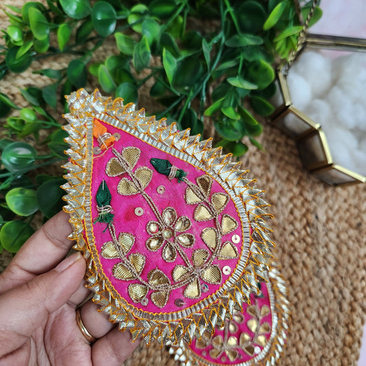 Decorative pink and gold embroidered piece for diwali festive decorations