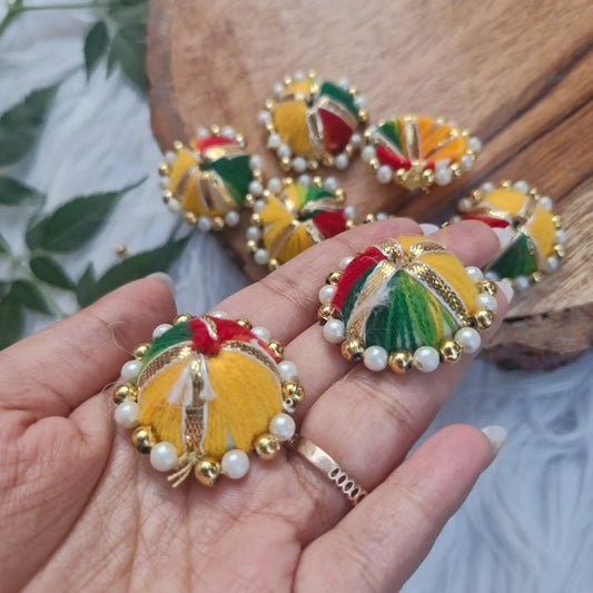 Handcrafted DIY Diwali latkan pom-pom with multicolor yarn and pearl-bead detailing for festive décor