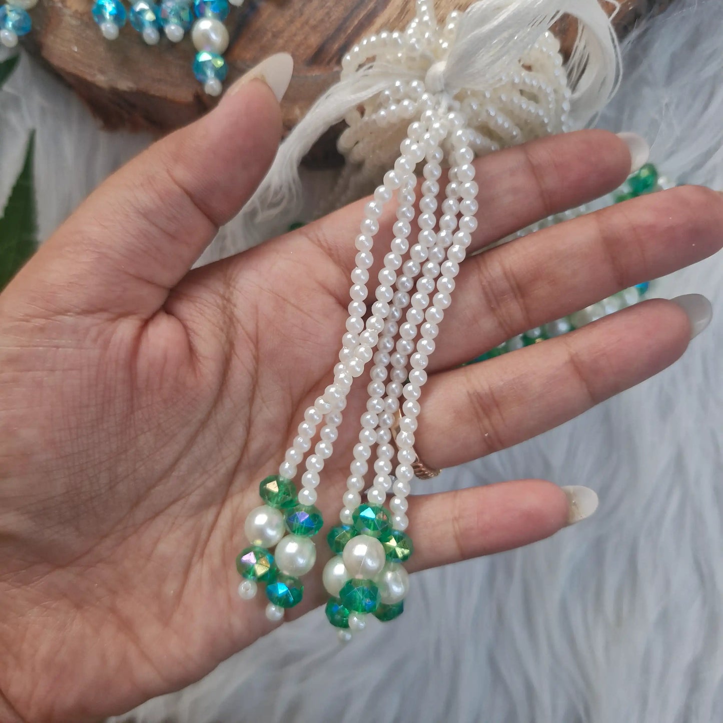 Handmade pearl tassel embellishment with green crystal beads for Diwali decorations and craft projects