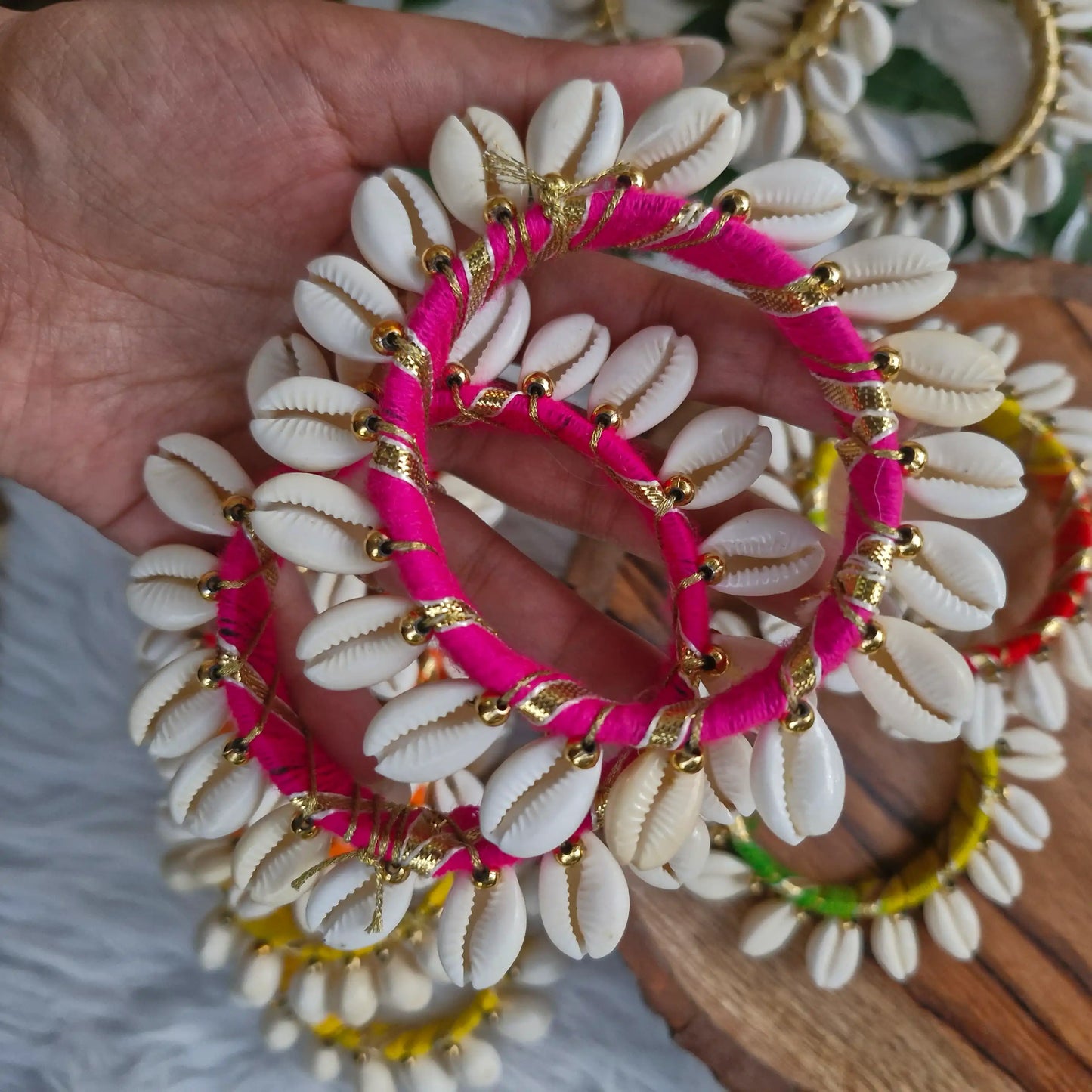 Decorative pink thread cowrie shell toran ring for wall and door hangings